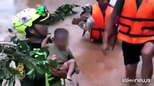 Salvataggio di un neonato in Laos dopo il crollo di una diga