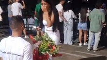 Young Woman Films Herself Only To Discover A Boy Kneeling With Flowers