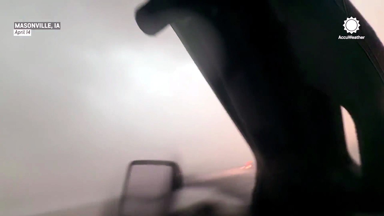 Rain-wrapped tornado sweeps through Iowa