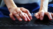 Caucasian female hands texting on laptop keyboard close up.