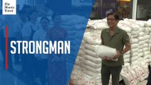 Who's sick? Marcos 'lifts' sacks of rice to dispel health rumors anew