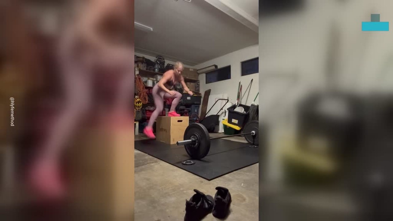 Box Jump Attempt Ends in Hard Fall During Garage Workout