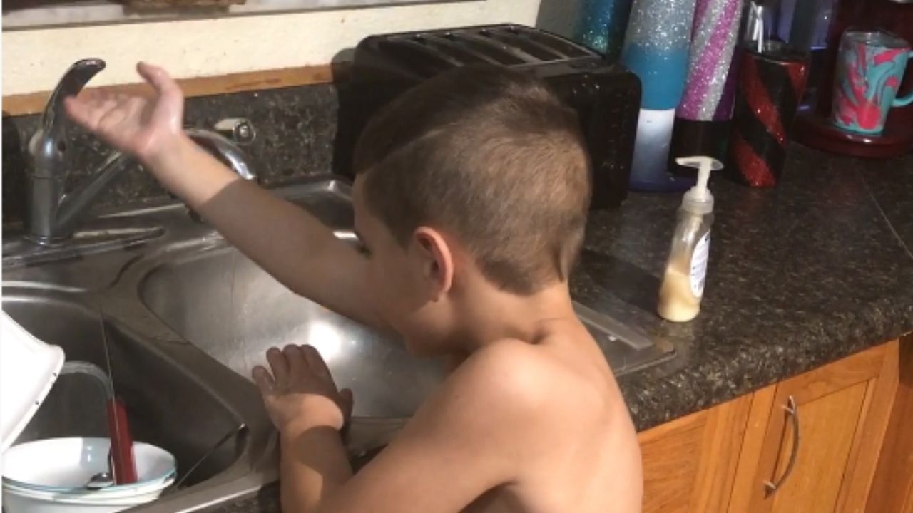 Little Boy Breaks Into Laughter After Harmless Faucet Prank by Dad