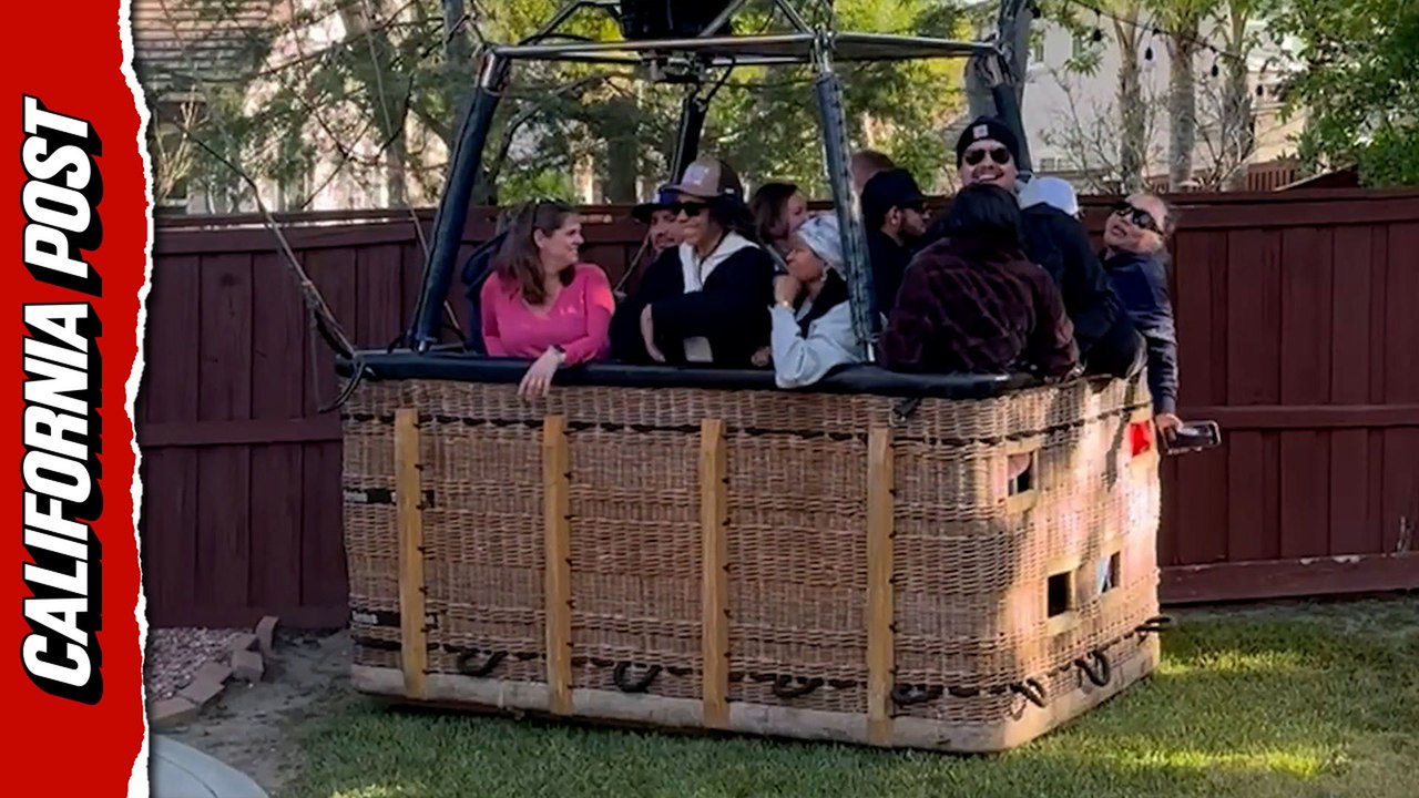 Wild moment hot air balloon lands in family's yard