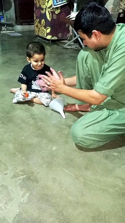 Salar ahmad playing with father