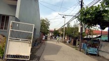 The Locals Are Up and About on Paralaya Street in Santo Tomas, Pampanga, Philippines