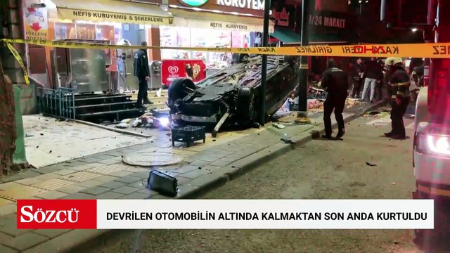 İş yerlerine çarpıp devrilen otomobilin altında kalmaktan son anda kurtuldu