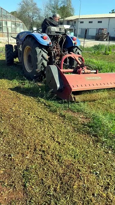 Tilling the soil with a tractor