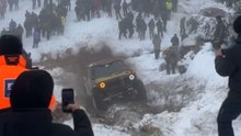 Watch this intense off-road fail as a 4x4 flips down a snowy hill in Romania