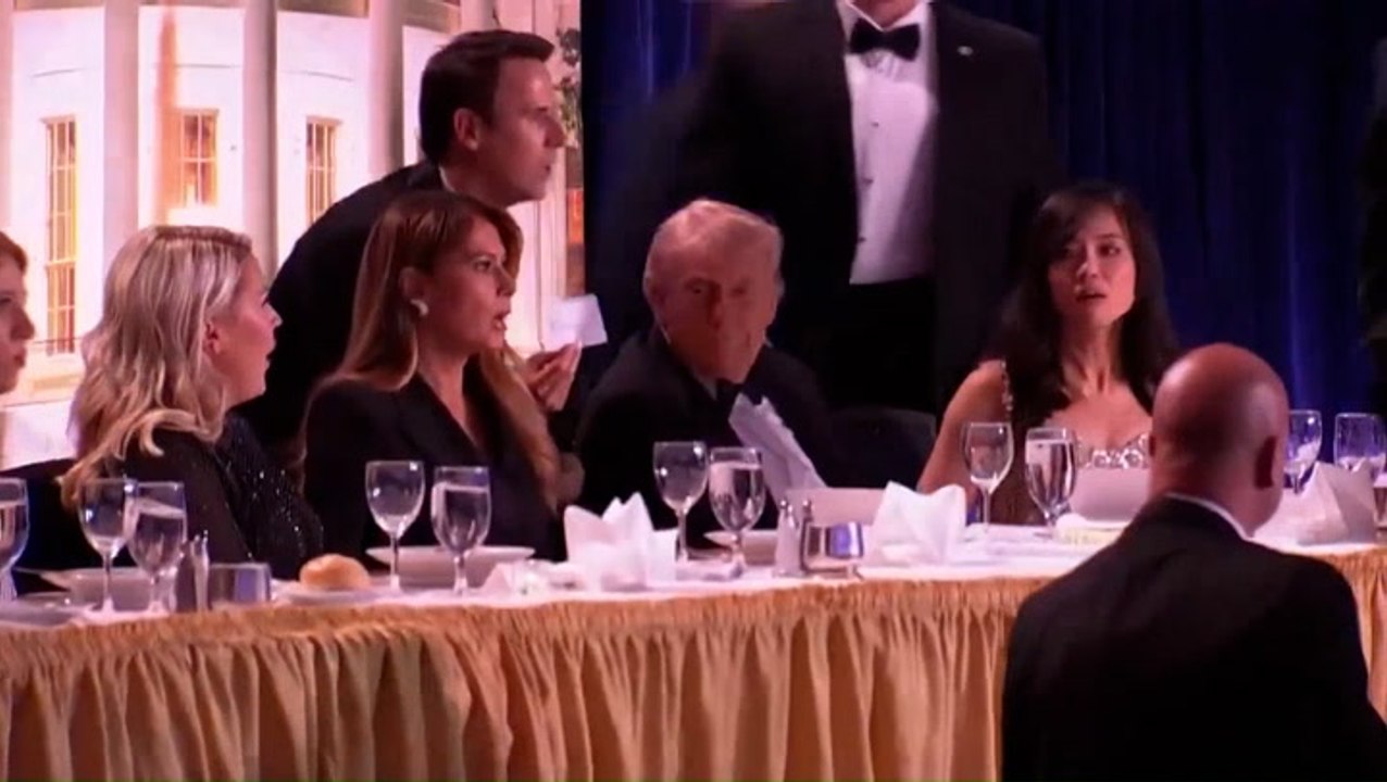 Moment Donald Trump is rushed off the stage after shots at White House Correspondents Dinner