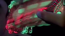 Chris Cards Glow V2 - a cardistry deck with invisible ink that lights up under UV-light