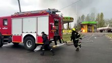Rescuers take cover as Russian drones attack Kharkiv