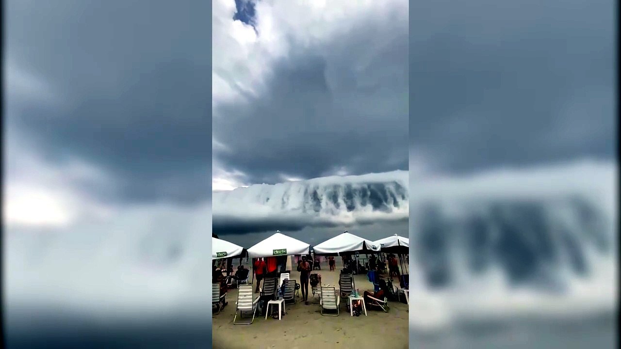 Nuvem gigante com formato de tsunami impressiona banhistas em praia de Bertioga (SP)