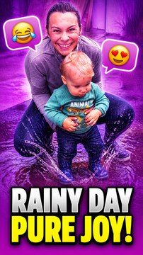 Mom assists her little boy in discovering his jumping potential in the rain