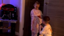 Little Girl Hands A Gift Bag Back After Receiving Flowers On Valentine’s Day