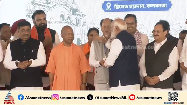 തുറന്ന വാഹനത്തിൽ ജനങ്ങളെ അഭിവാദ്യം ചെയ്ത് മോദി; പശ്ചിമ ബംഗാളിൽ സത്യപ്രതിജ്ഞ ചടങ്ങ് തുടങ്ങി