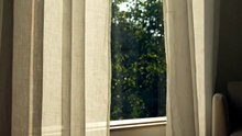 Soft Breezy Drift: White Curtains in the Wind