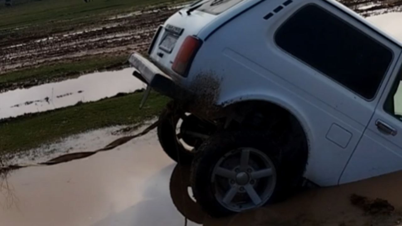 Loader Recovers A Vehicle Trapped In A Waterlogged Area