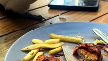 Cockatoo eating someone’s food