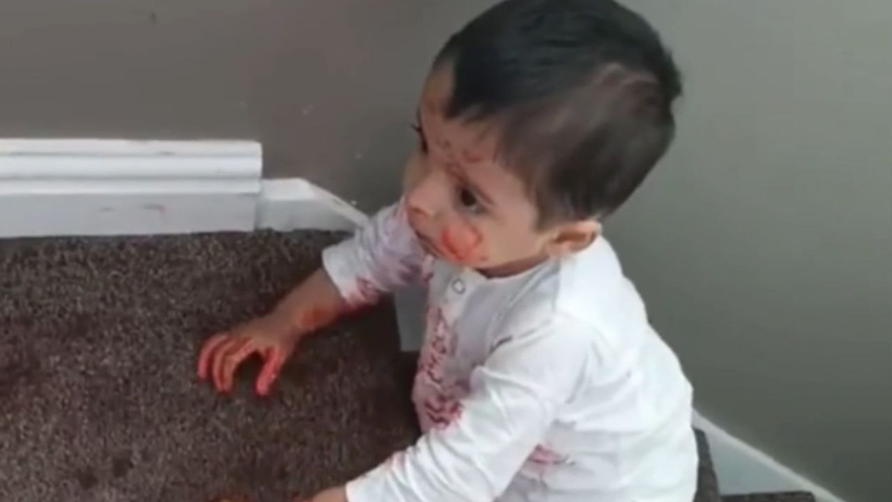 Hungry toddler shares his favorite drink with the carpet!
