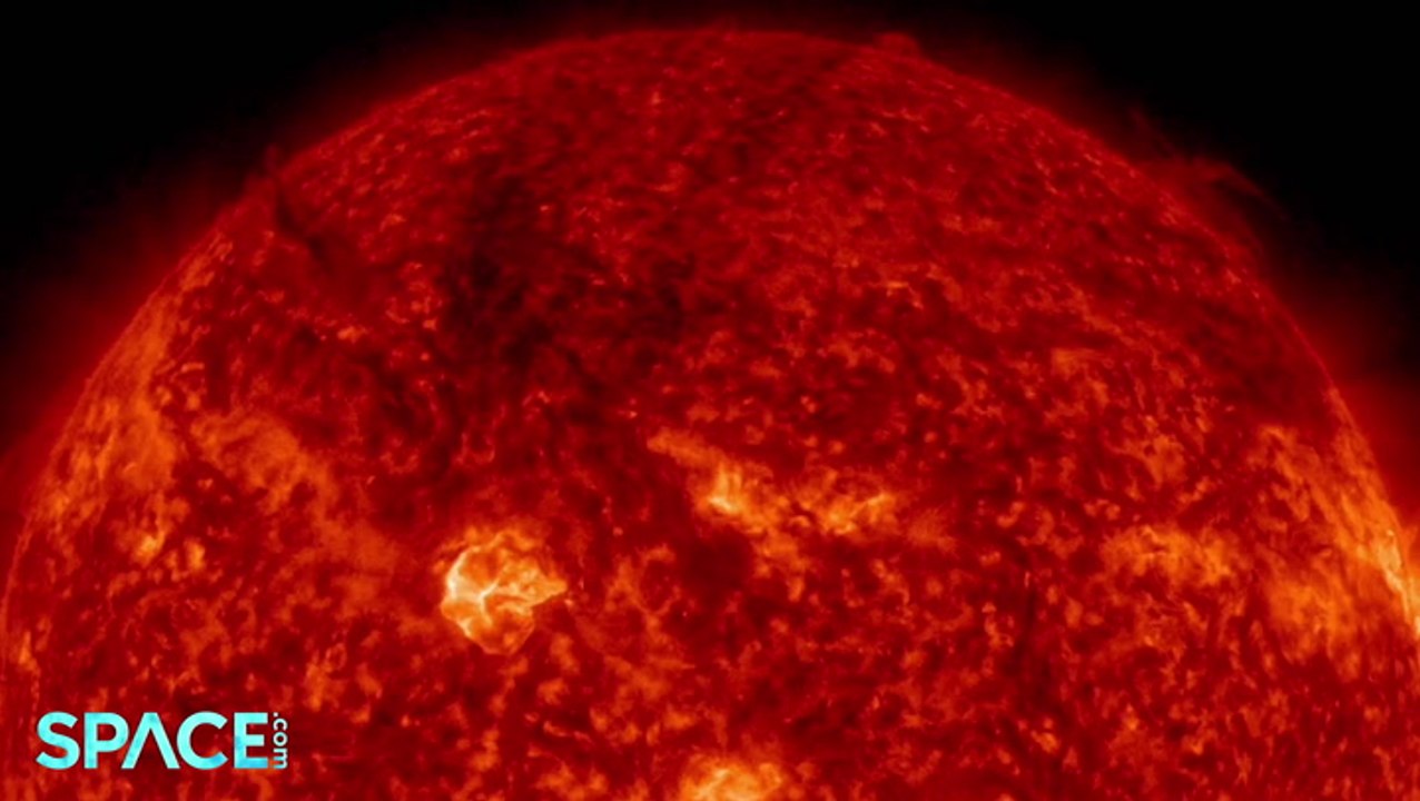 Strong Solar Flare Spews Dark Plumes Of Plasma,...