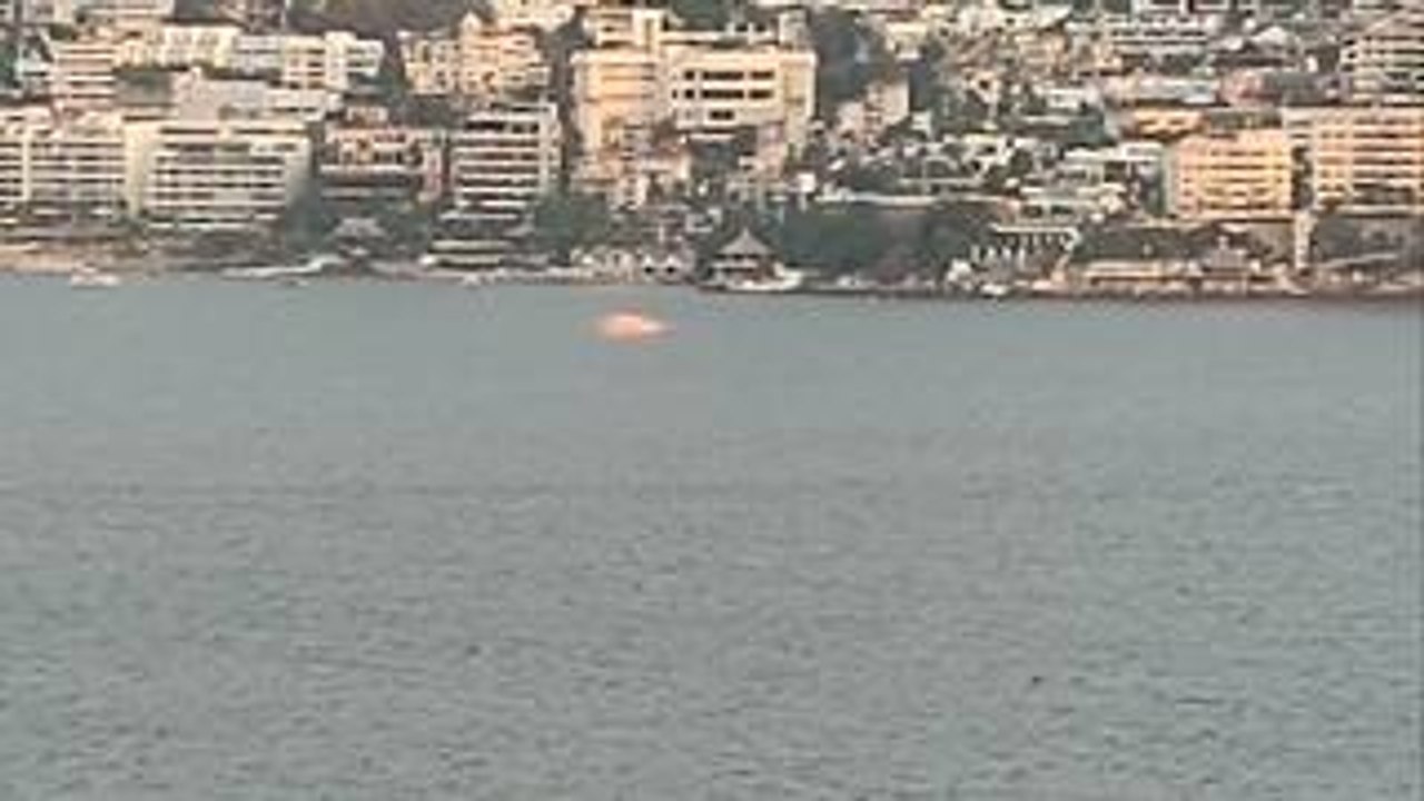Person Captures Mysterious Glowing Object Hovering Above Ocean Water