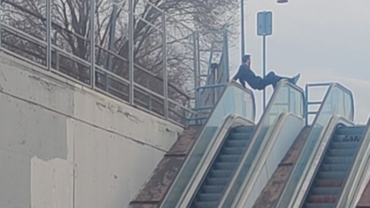Boy Chooses Escalator Handrails Over Steps For A Risky Ride