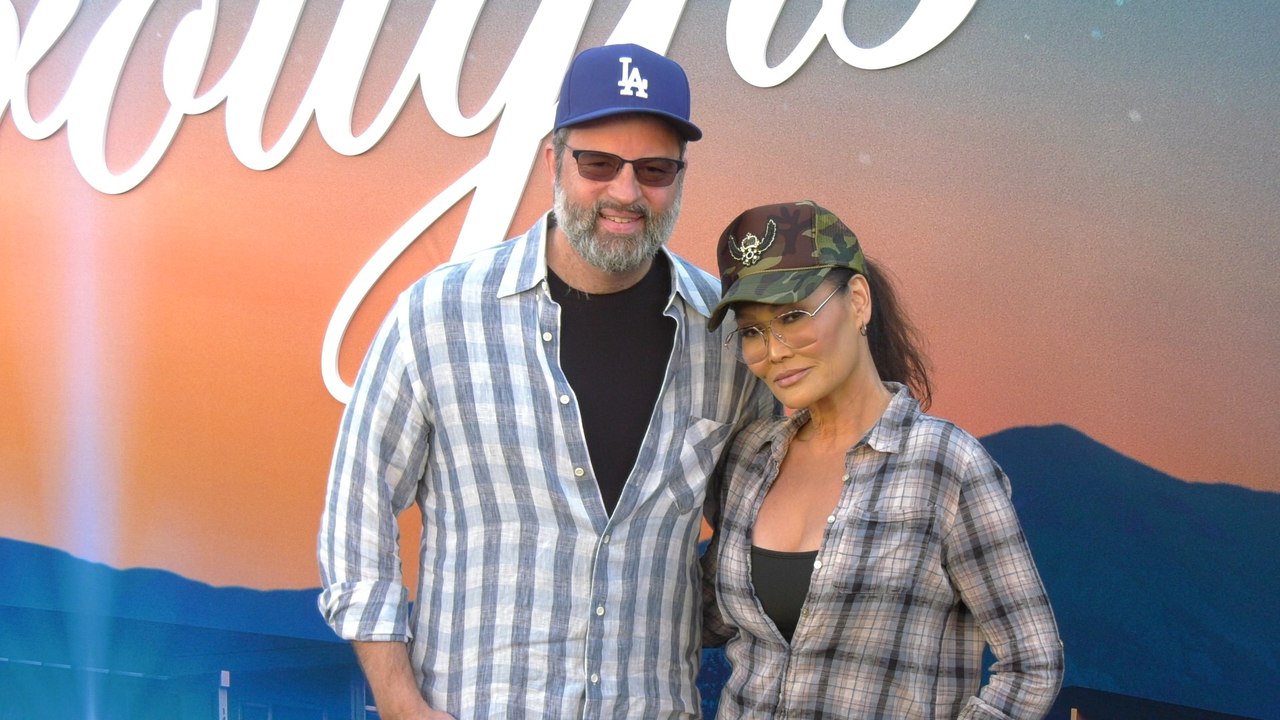 Paul Debevec and Tia Carrere attend the premiere of Netflix's "The Boroughs" in Los Angeles