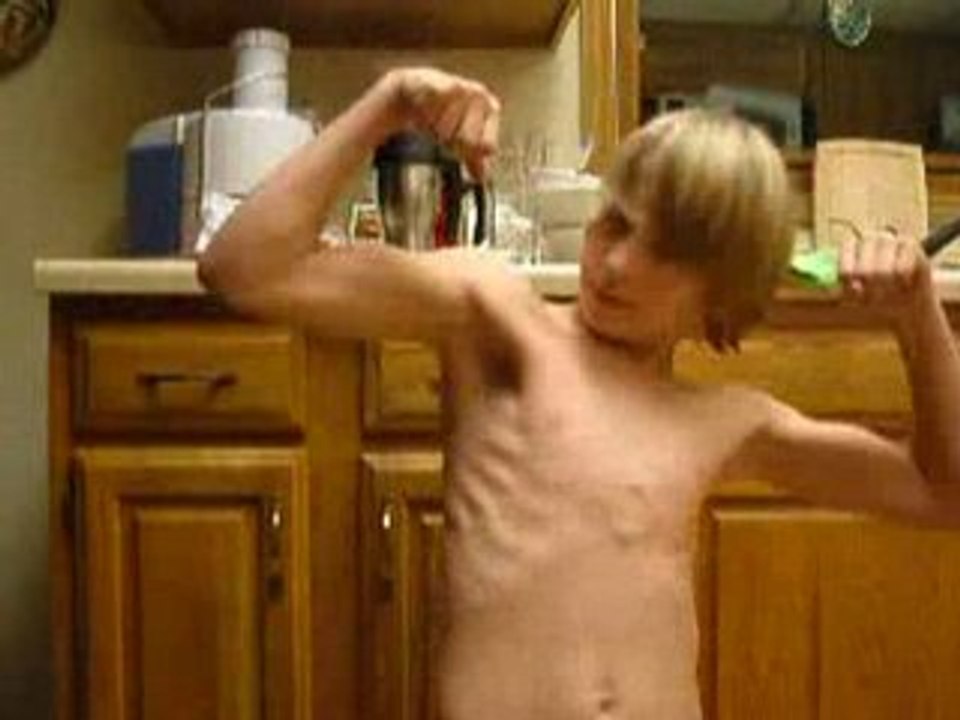 Teen boy flexing 1