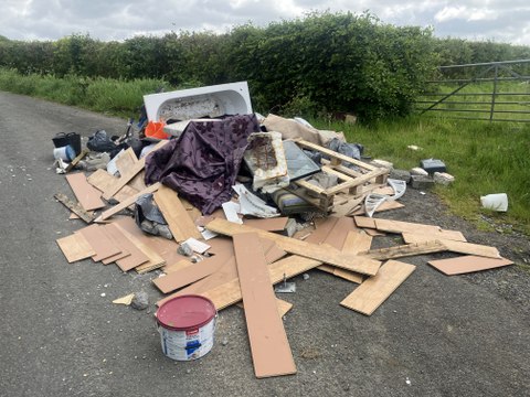 Carmarthenshire Council seeks public help on significant flytipping incident on rural lane