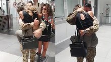 Wife leaps into the arms of her military spouse at the airport upon his return from duty