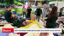 Semt pazarında kendi bestelerini seslendirip satış yapıyor