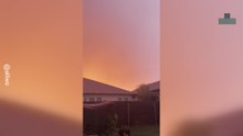Thunderstorm Ignites Red Austin Sky With Lightning