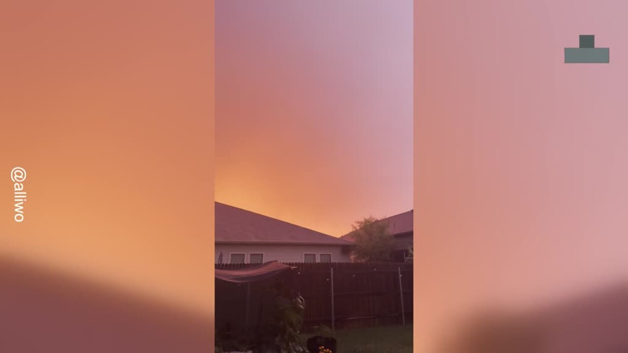 Thunderstorm Ignites Red Austin Sky With Lightning