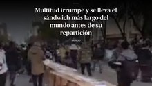 Multitud irrumpe y se lleva el sándwich más largo del mundo antes de su repartición