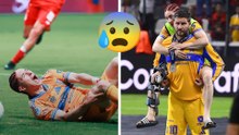Marcelo Flores sale de la cancha cargado por André-Pierre Gignac tras lesión en la rodilla