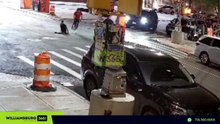 The surveillance camera captured images of men climbing out of a sewer in Brooklyn, New York City, carrying tools.