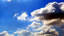 Clouds Drifting Across a Vivid Blue Sky