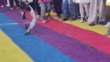 Martial arts performing robot kicks boy in the stomach