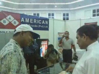 Mr. Jayasinghe Giving a belkin to Rajitha @ a trade show