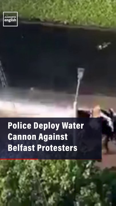 Police Deploy Water Cannon as Protesters Try to Reach a Migrant Hotel