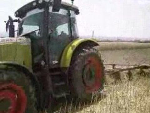 CLAAS ARES 567 ATX PLOUGHING THE CANOLA FIELD 2008 PART1