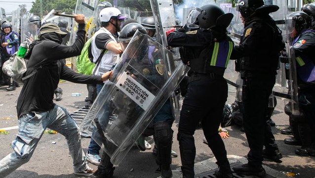 Protesters in Mexico clash with riot police outside stadium during World Cup opener