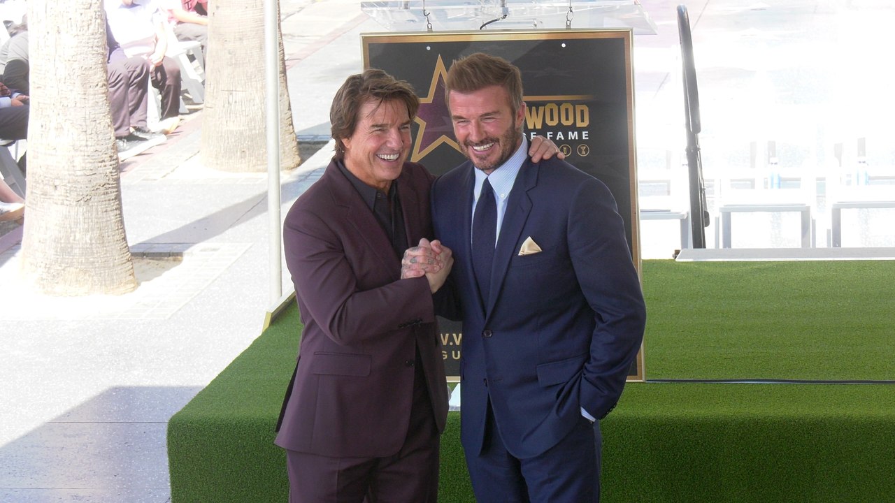 David Beckham poses with Tom Cruise next to his star on the Hollywood Walk of Fame