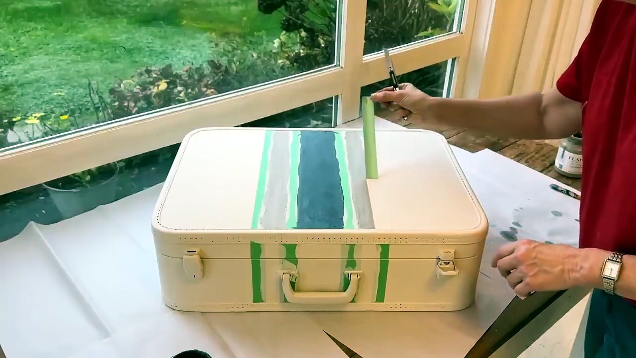 Put a suitcase on your entryway wall (this is GENIUS!)