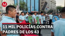 Padres de los 43 denuncian que gobierno los criminalizó con 11 mil policías en caseta