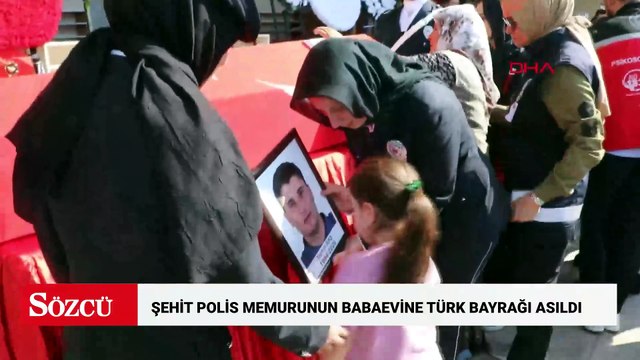 Şehit polis memurunun babaevine Türk bayrağı asıldı