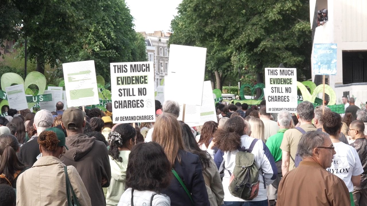 Grenfell demonstrators embrace firefighters during anniversary march