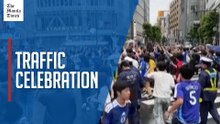 Japanese fans celebrate World Cup draw by taking over Tokyo traffic crossing
