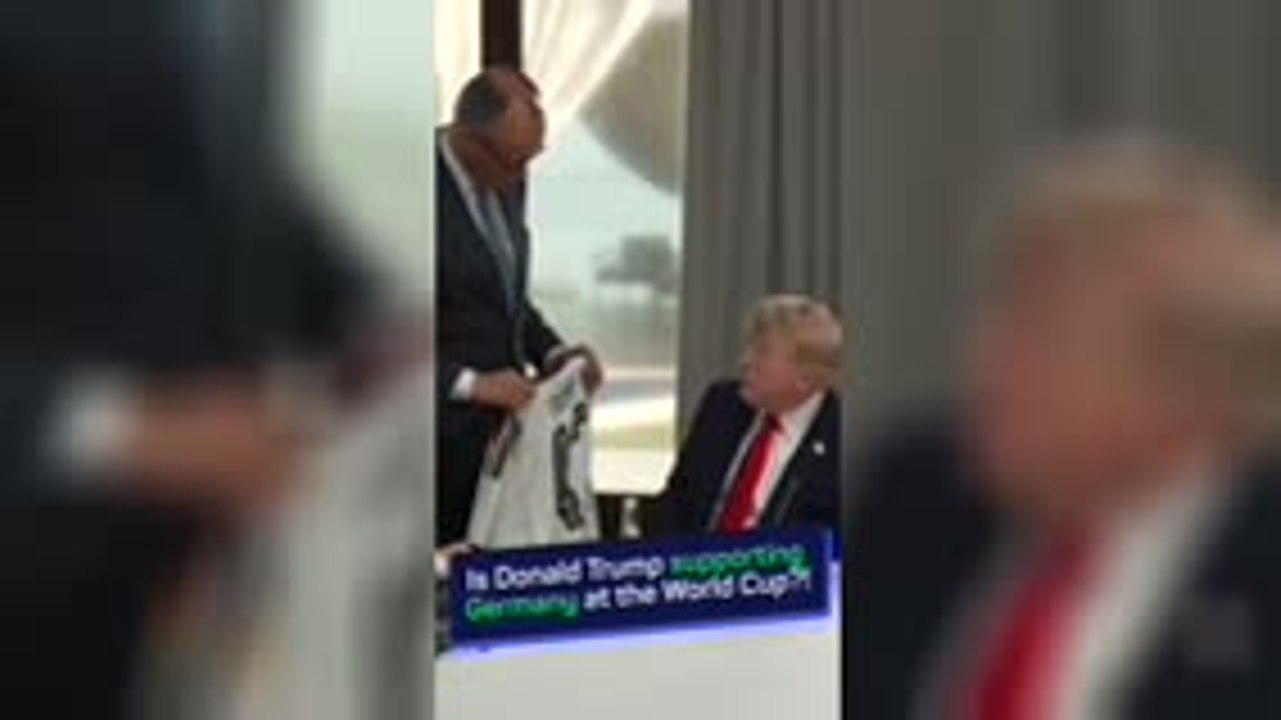 Donald Trump receives Germany shirt during G7 summit